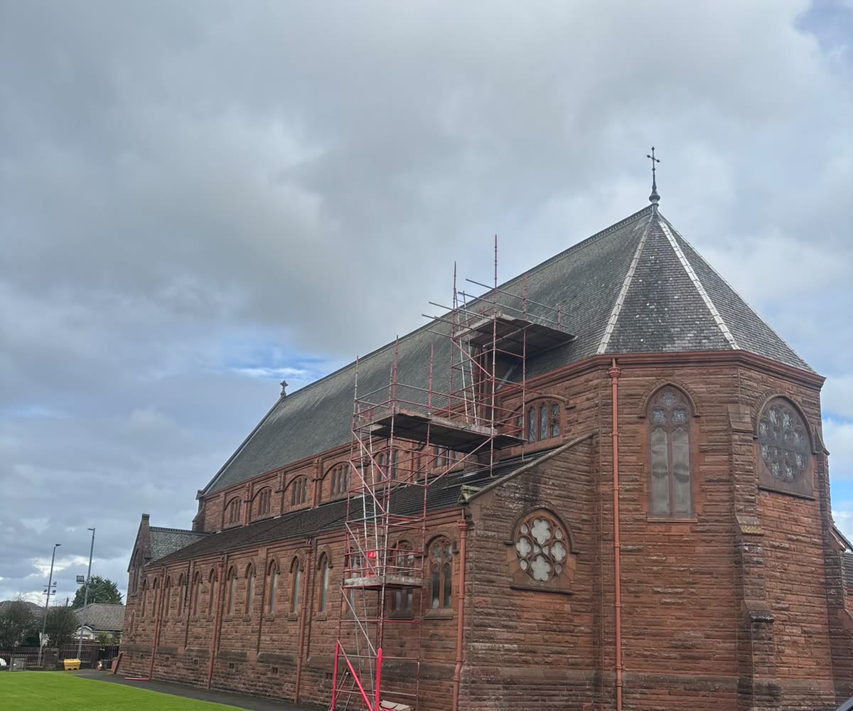 Scaffold up for slate repairs on a sandstone church