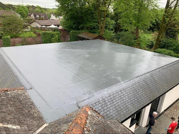 New grey fibreglass flat roof installed by LA Roofing