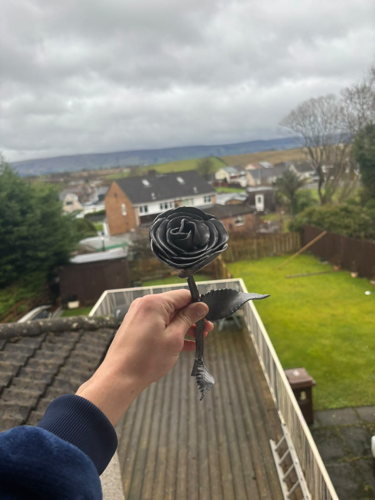 Hand-crafted lead rose made by LA Roofing on the roof