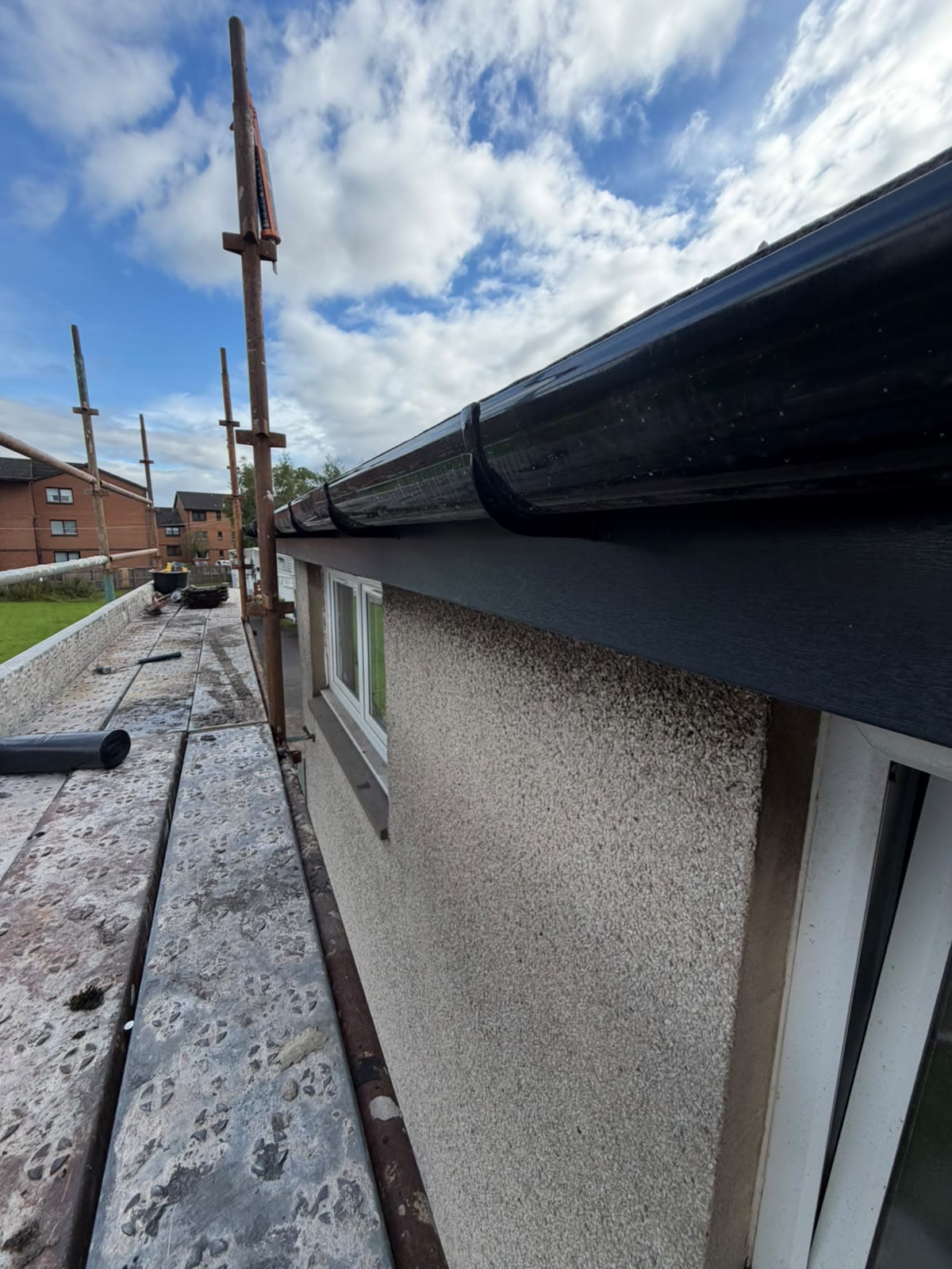 New black uPVC guttering and fascia installed by LA Roofing