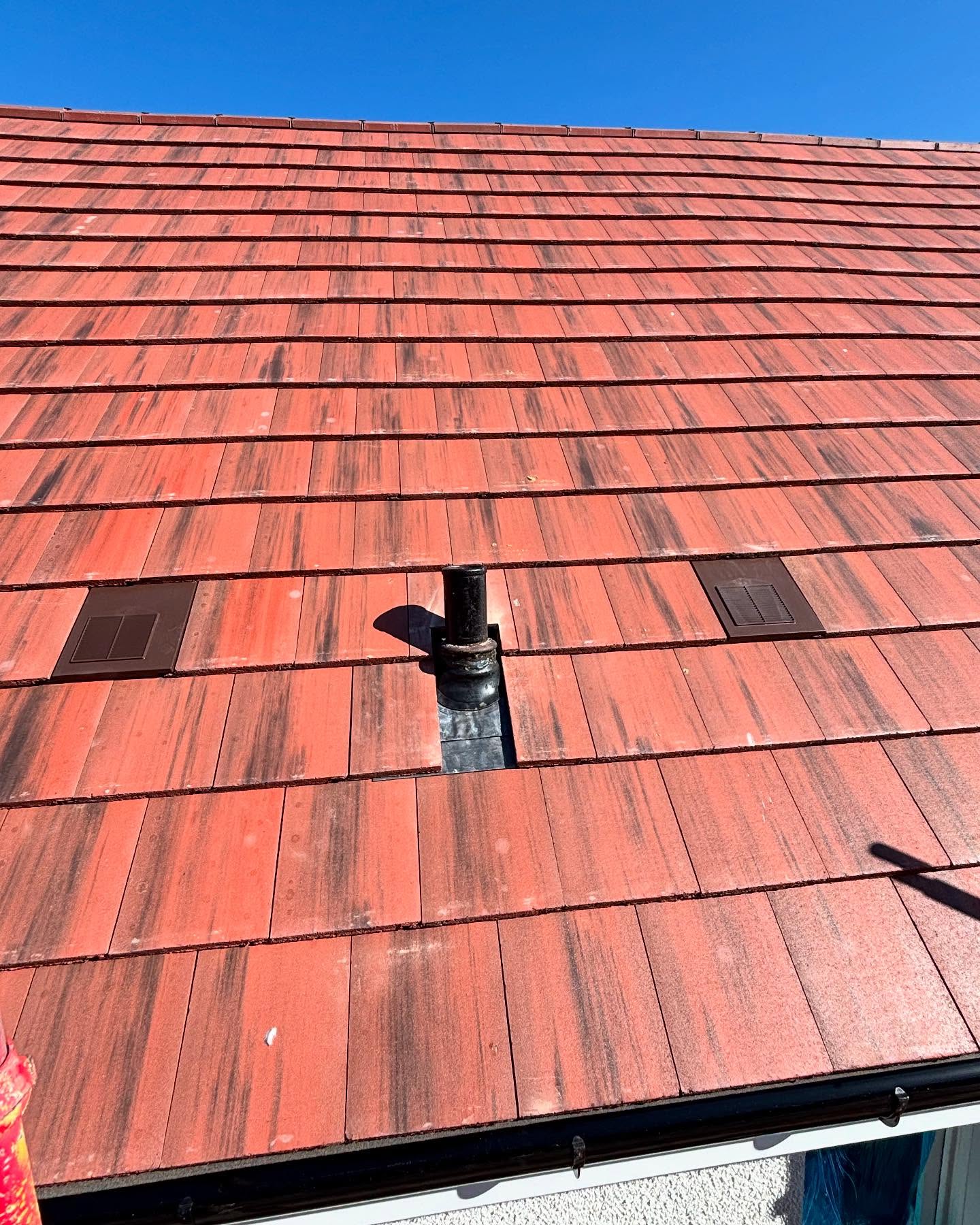 New tiled roof with vents and flashing