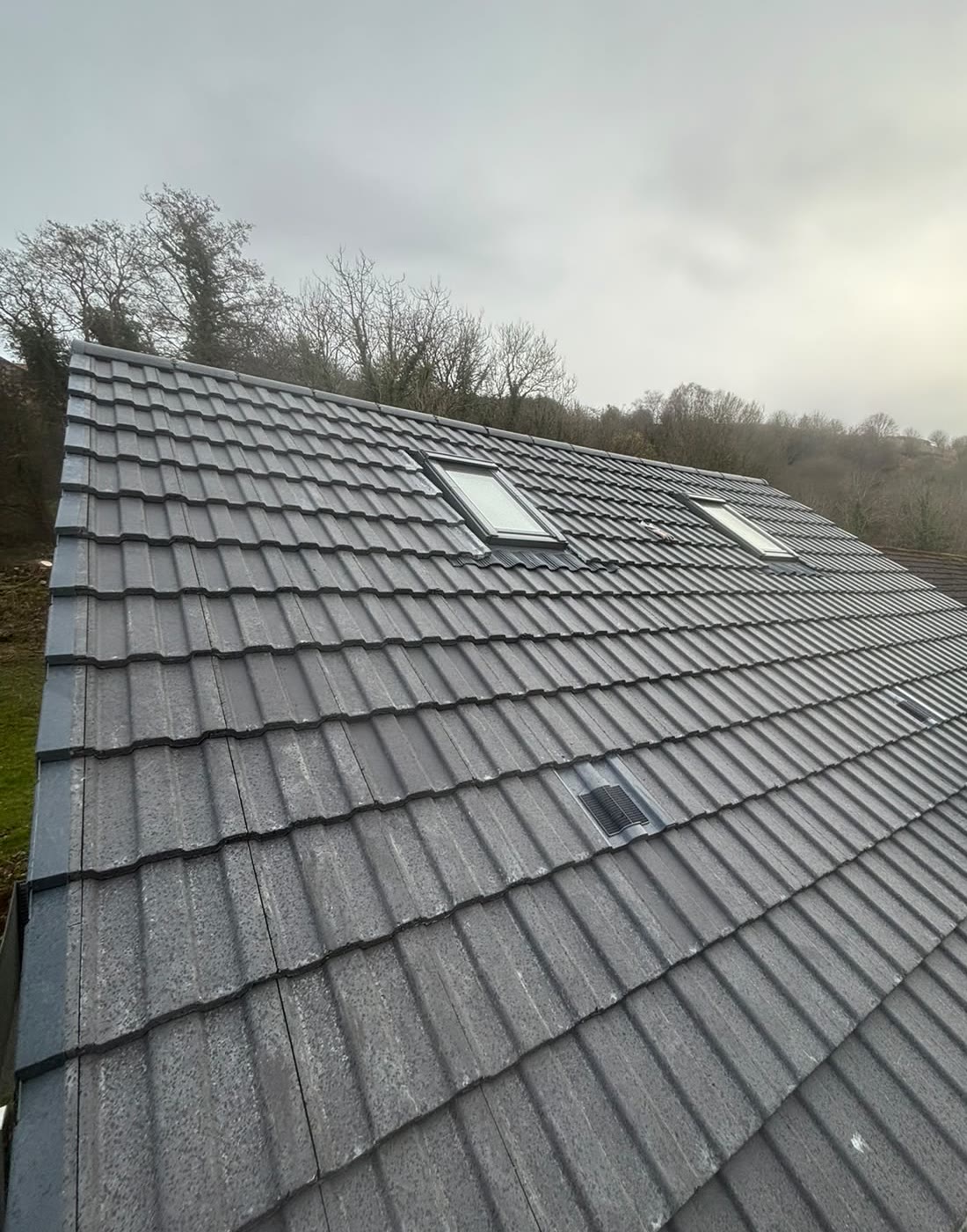 New tiled roof with two roof windows by LA Roofing
