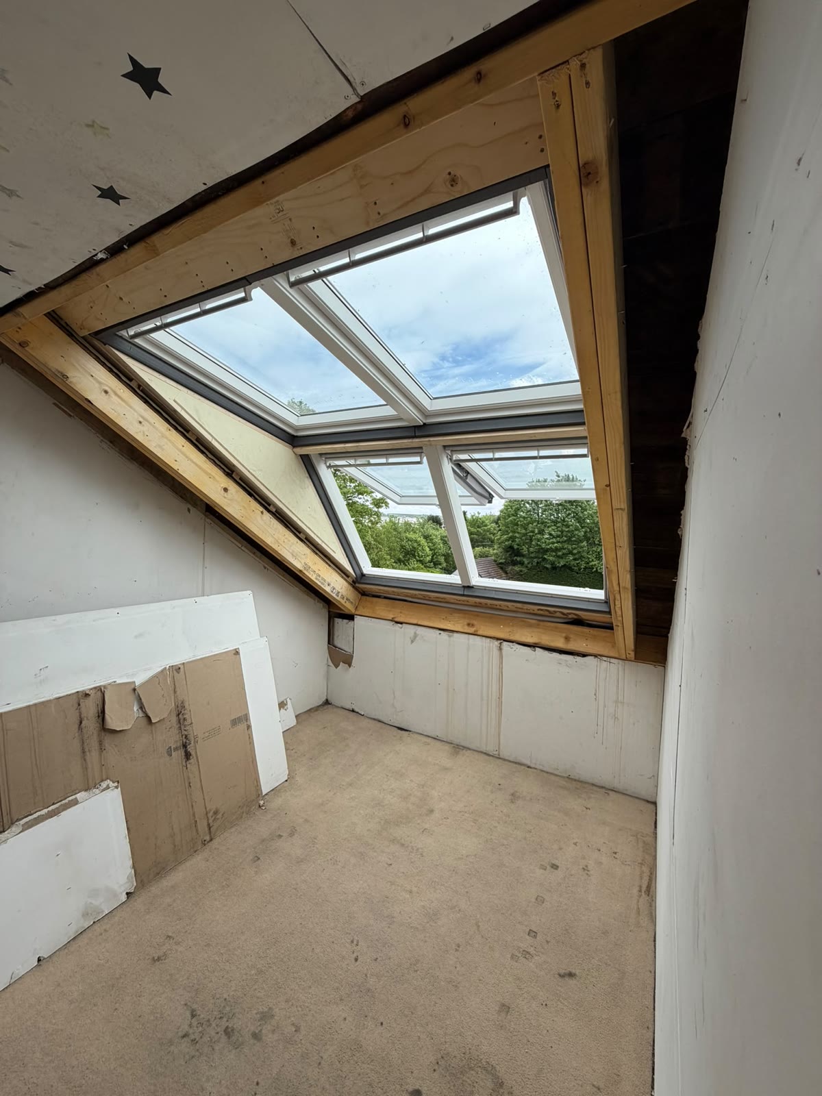 Loft interior flooded with light from new Velux roof windows